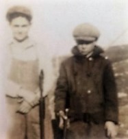 My dad, B.L. Roberts is on the right ca 1930. Both boys have pump .22 rifles.